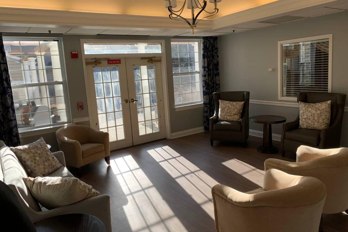Front Lounge, with comfortable chairs and a sofa, with Fresh Doors leading outdoors.